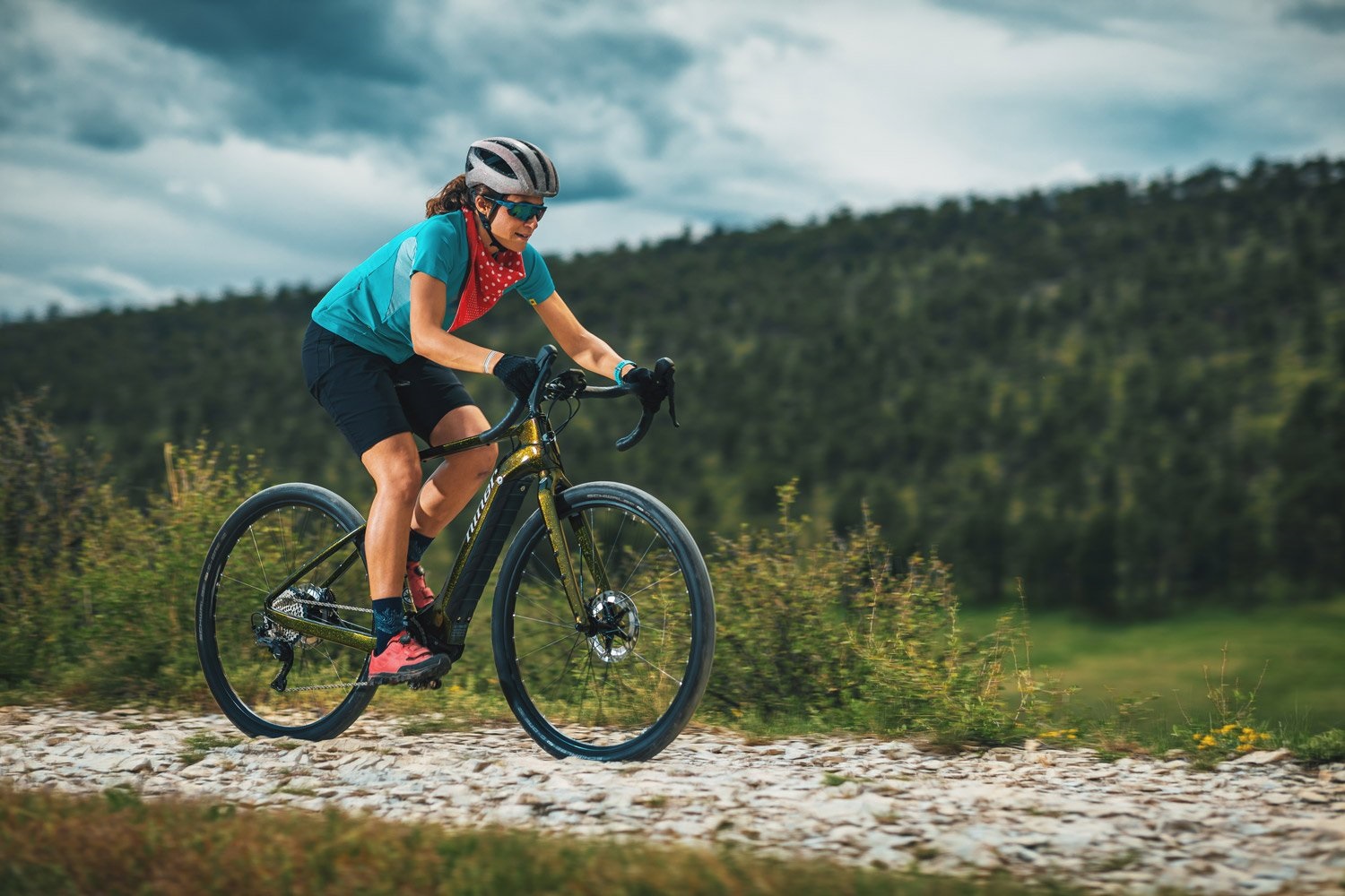 woman riding a niner electric gravel bike