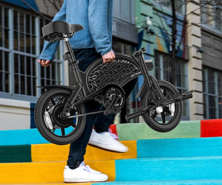 man carrying jetson bolt pro electric bike up stairs