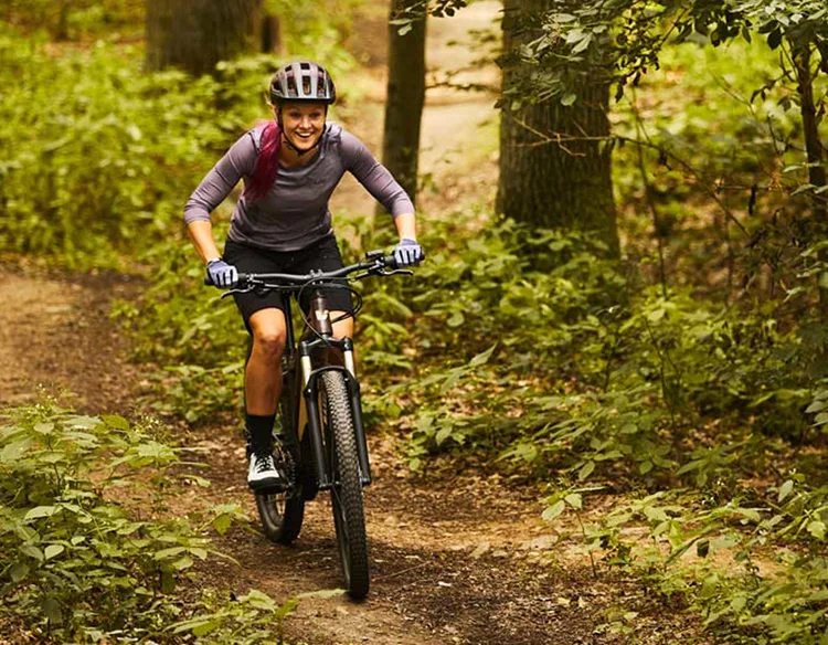 woman riding electric mountain bike