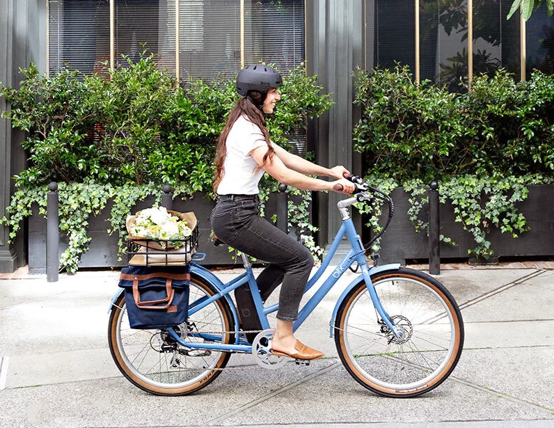 woman riding a city electric bike