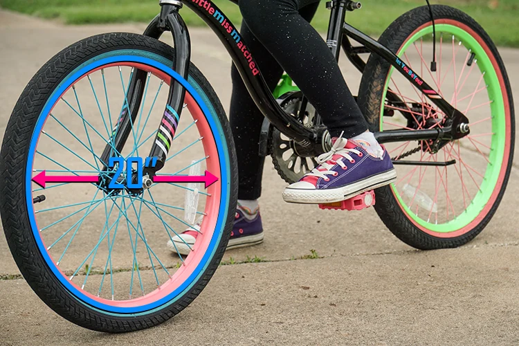 girl riding colorful 20 inch kids bike
